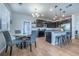 Charming dining area with modern gray chairs, a round table, stylish lighting, and access to the kitchen at 4630 Copeland Cir # 201, Highlands Ranch, CO 80126