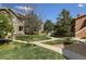 Well-manicured grounds between buildings with mature trees and manicured lawn at 4630 Copeland Cir # 201, Highlands Ranch, CO 80126