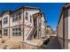 Exterior view of a condo with stairs leading up to the front door at 4630 Copeland Cir # 201, Highlands Ranch, CO 80126