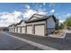 View of the garages connected to the condos on a sunny day at 4630 Copeland Cir # 201, Highlands Ranch, CO 80126