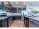 Spacious kitchen features granite countertops, stainless appliances and ample cabinet space at 4630 Copeland Cir # 201, Highlands Ranch, CO 80126
