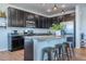 Modern kitchen with granite counters, stainless appliances and large center island with breakfast bar at 4630 Copeland Cir # 201, Highlands Ranch, CO 80126