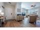 Open-concept living room showcasing stylish decor, wood-look floors, a ceiling fan, and a comfortable seating arrangement at 4630 Copeland Cir # 201, Highlands Ranch, CO 80126