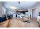 Open-concept living space featuring modern decor, a kitchen island, and a dining area with stylish furnishings at 4630 Copeland Cir # 201, Highlands Ranch, CO 80126