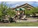 Community playground with colorful slides and climbing structures at 4630 Copeland Cir # 201, Highlands Ranch, CO 80126
