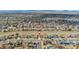 Expansive aerial view of a residential neighborhood with mountain views in the distance at 13463 Quivas St, Westminster, CO 80234