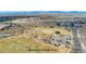 Aerial view of Broomfield Quail Park and surrounding area with mountains in the distance at 13463 Quivas St, Westminster, CO 80234