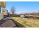 Large, fenced backyard with a shed and patio, perfect for enjoying the outdoors and storage at 13463 Quivas St, Westminster, CO 80234