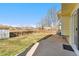 Large, fenced backyard with a patio, shed, and well-maintained lawn, perfect for outdoor activities at 13463 Quivas St, Westminster, CO 80234