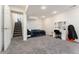 Basement bedroom with gray carpet, white walls, and walk-up stairs at 13463 Quivas St, Westminster, CO 80234