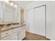 Bright bathroom with granite vanity and closet at 13463 Quivas St, Westminster, CO 80234