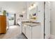 Bathroom vanity with granite top next to bedroom at 13463 Quivas St, Westminster, CO 80234