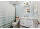 Bright bathroom with a modern vanity, stylish mirror, and tiled shower-tub combo at 13463 Quivas St, Westminster, CO 80234