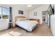 Well-lit bedroom with neutral tones and comfortable furnishings at 13463 Quivas St, Westminster, CO 80234