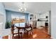 Bright dining area with hardwood floors and a view of the backyard at 13463 Quivas St, Westminster, CO 80234