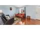 Bright living room with hardwood floors, comfortable seating, and a large window at 13463 Quivas St, Westminster, CO 80234