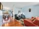 Open-concept living space with hardwood floors, and a view of the dining area at 13463 Quivas St, Westminster, CO 80234