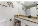 Bathroom featuring a granite vanity, stylish decor, and modern fixtures at 2182 S Victor St # D, Aurora, CO 80014