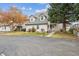 Charming exterior view of the home featuring a well-maintained lawn, inviting entryway, and dormer windows at 2182 S Victor St # D, Aurora, CO 80014