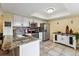 Well-lit kitchen featuring stainless steel appliances, granite countertops, and ample cabinet space at 2182 S Victor St # D, Aurora, CO 80014