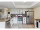 Modern kitchen with white cabinetry, granite countertops, and stainless steel appliances at 2182 S Victor St # D, Aurora, CO 80014