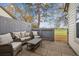 Cozy patio area with stylish wicker furniture and a view of the green golf course at 2182 S Victor St # D, Aurora, CO 80014