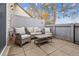 Inviting patio area with comfortable wicker seating, ideal for enjoying the outdoors at 2182 S Victor St # D, Aurora, CO 80014