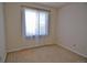 Bedroom with neutral carpet, large window, and natural light at 9568 W San Juan Cir # 307, Littleton, CO 80128