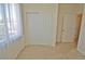 Bedroom with neutral carpet, sliding closet doors, and a window with sheer curtains at 9568 W San Juan Cir # 307, Littleton, CO 80128