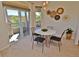 Cozy dining area with modern decor, light fixture, access to the balcony at 9568 W San Juan Cir # 307, Littleton, CO 80128