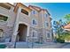 Attractive condo building with brick accents and well-maintained landscaping under a clear sky at 9568 W San Juan Cir # 307, Littleton, CO 80128