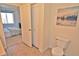 Hallway featuring access to the toilet and main bedroom at 9568 W San Juan Cir # 307, Littleton, CO 80128
