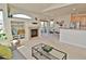 Bright, open living space with a fireplace, adjacent dining area, and kitchen at 9568 W San Juan Cir # 307, Littleton, CO 80128