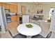 Open floor plan showcasing the kitchen, dining area, and living room in a bright space at 9568 W San Juan Cir # 307, Littleton, CO 80128