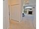 View of the living room with fireplace and neutral carpeting at 9568 W San Juan Cir # 307, Littleton, CO 80128