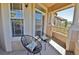 Porch with chairs and pillows offers a relaxing view of the community at 9568 W San Juan Cir # 307, Littleton, CO 80128