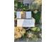 Stunning aerial view of home with lush green landscaping, mature trees, and inviting backyard patio perfect for relaxing outdoors at 3665 Estes St, Wheat Ridge, CO 80033