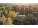 Gorgeous aerial view of the home showcasing surrounding greenery and lush trees at 3665 Estes St, Wheat Ridge, CO 80033