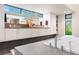 Stunning bathroom boasts lots of counter space, dual sinks, and an abundance of natural light at 3665 Estes St, Wheat Ridge, CO 80033