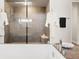 Luxurious bathroom features a large glass shower, soaking tub, and high end fixtures at 3665 Estes St, Wheat Ridge, CO 80033