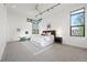 Modern bedroom offers an abundance of natural light with sleek ceiling fans at 3665 Estes St, Wheat Ridge, CO 80033