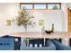 Dining room with modern table and chairs. Large windows allow for lots of natural light at 3665 Estes St, Wheat Ridge, CO 80033