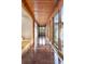Hallway features wood beams and large windows offering lots of natural light at 3665 Estes St, Wheat Ridge, CO 80033