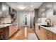 Bright, updated kitchen with an abundance of natural light, stainless steel appliances, and granite counters at 3665 Estes St, Wheat Ridge, CO 80033