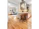 Charming kitchen with stainless steel appliances, breakfast bar, and hardwood floors at 3665 Estes St, Wheat Ridge, CO 80033