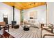 Inviting living room with modern decor, a fireplace, and natural light streaming through the windows at 3665 Estes St, Wheat Ridge, CO 80033