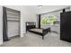 Bright bedroom with a large arched window, closet, and views of surrounding mountains at 1500 Buckeye Cir, Georgetown, CO 80444