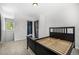 Cozy bedroom features a closet and doorway to an ensuite bathroom with stylish tile shower at 1500 Buckeye Cir, Georgetown, CO 80444