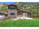 Well-maintained exterior features a bright green lawn and stunning mountain backdrop at 1500 Buckeye Cir, Georgetown, CO 80444