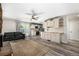 Open concept living area with view of kitchen, stone fireplace, outdoor access, and hardwood style floors at 1500 Buckeye Cir, Georgetown, CO 80444